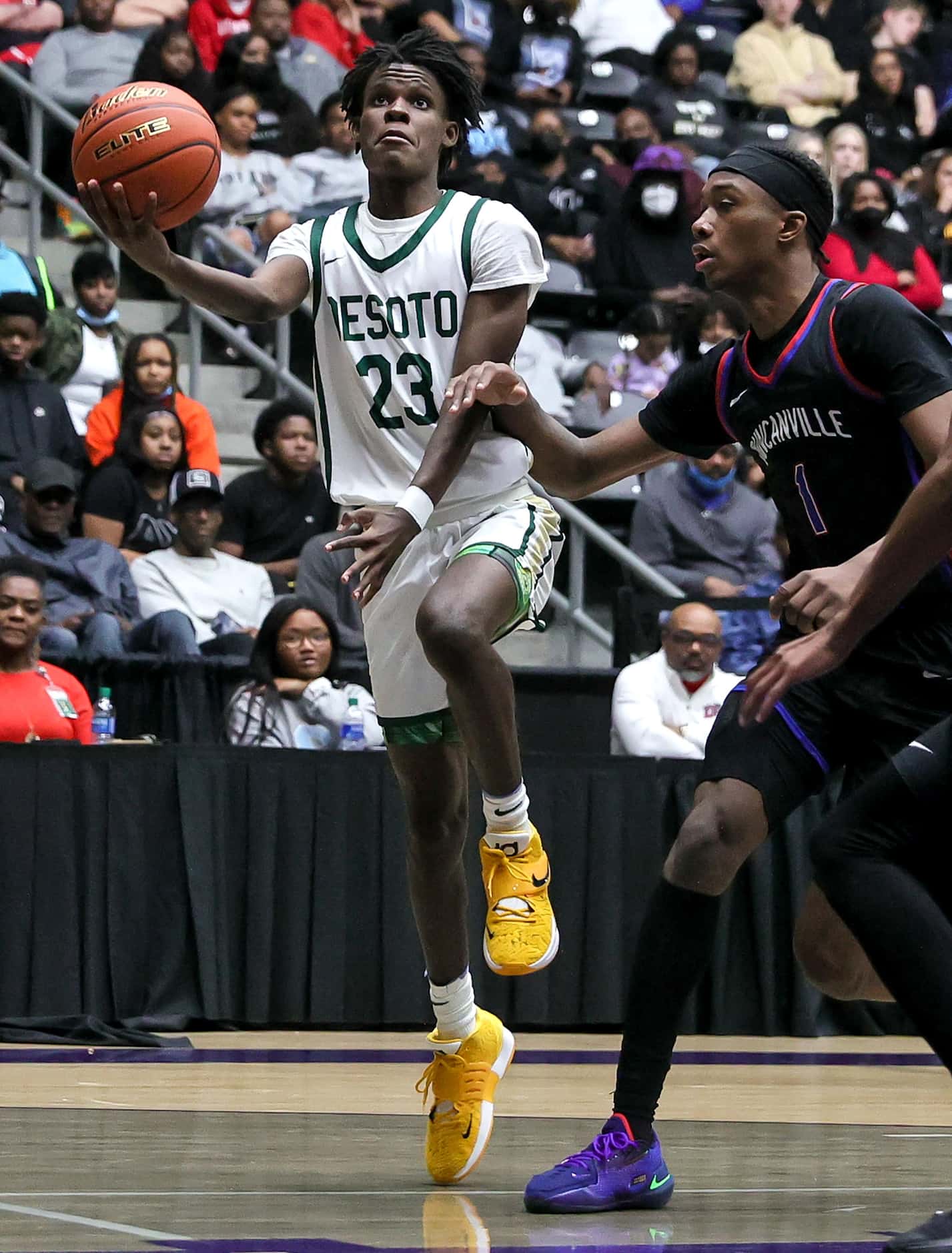 DeSoto guard Malik Jones (23) tries to go in for a layup against Duncanville forward Ron...
