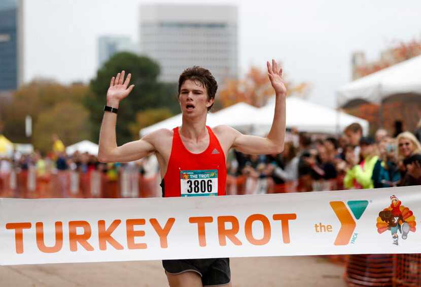 Craig Lautenslager wins first place in the men's 8-mile run at the Dallas YMCA Turkey Trot...