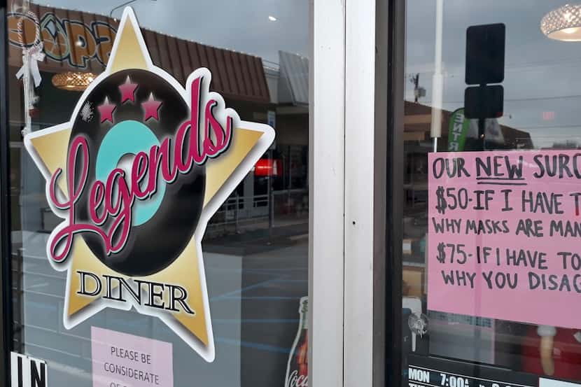 The co-owners of Legends Diner in Denton posted a sign on the restaurant in mid-March 2021,...