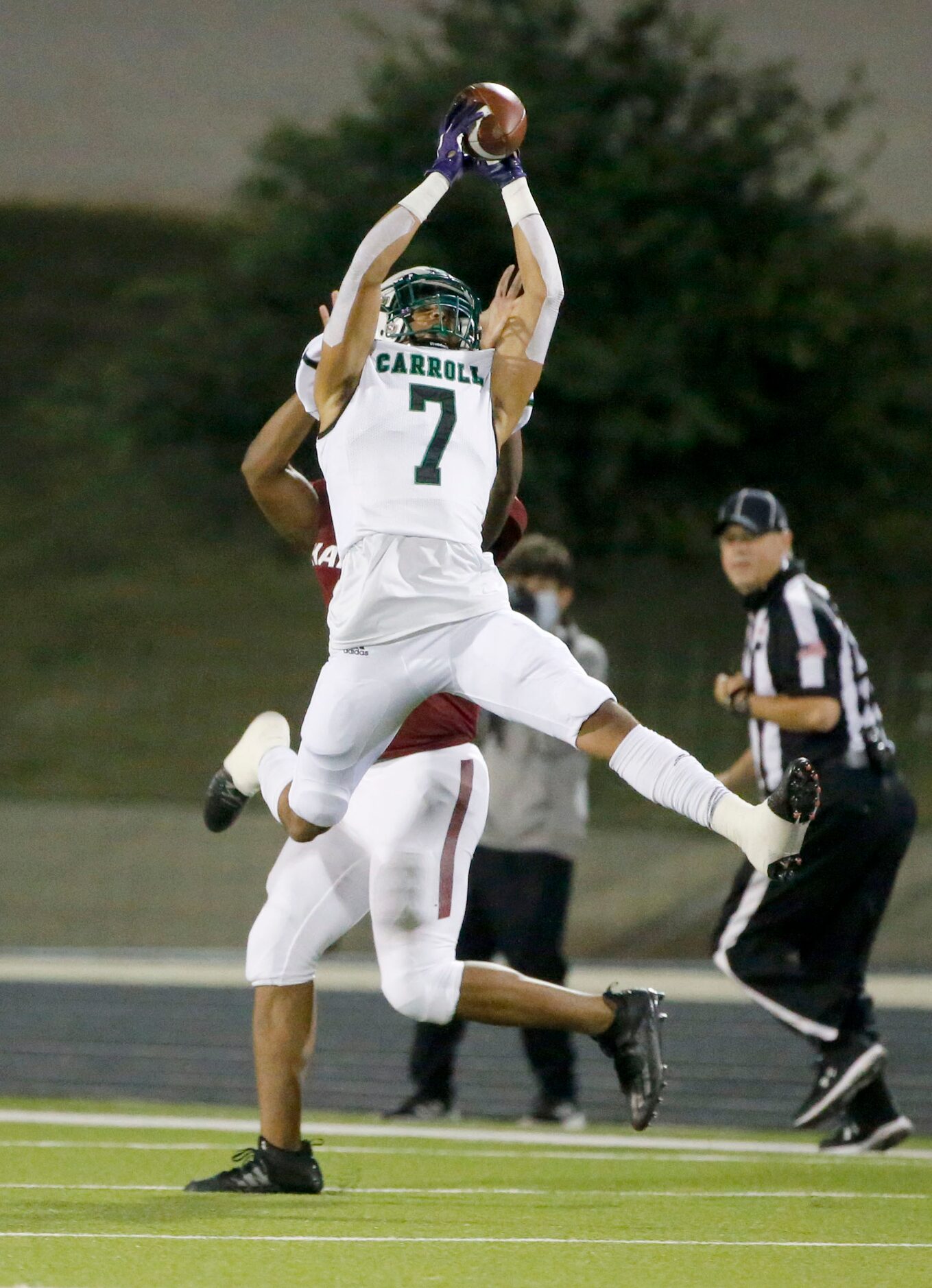 Southlake Carroll’s Avyonne Jones (#7) makes an interception against Keller Central during...