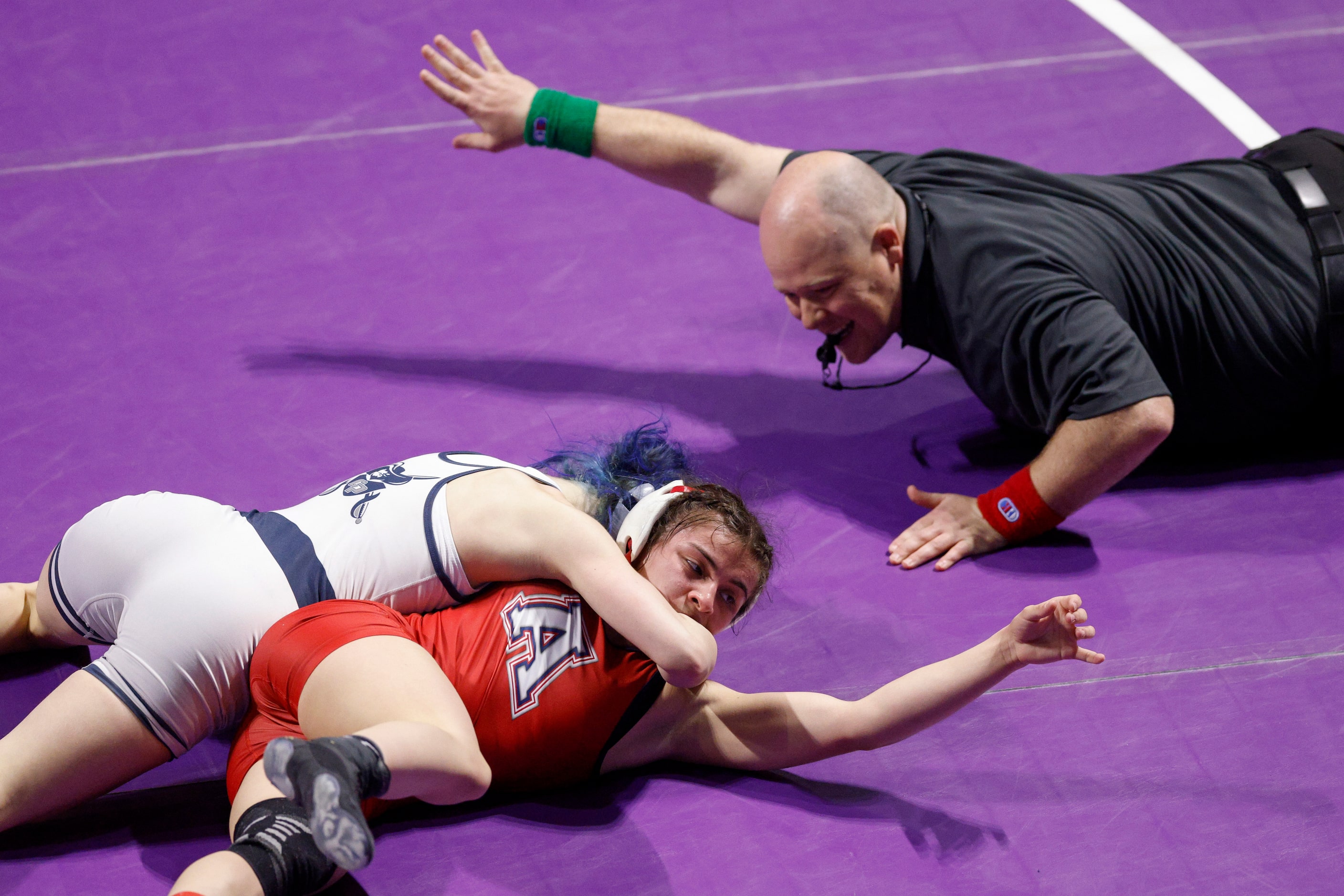 Olivia Degeorgio of Conroe Woodlands College Park (left) wrestles Eliana Martinez of Allen...