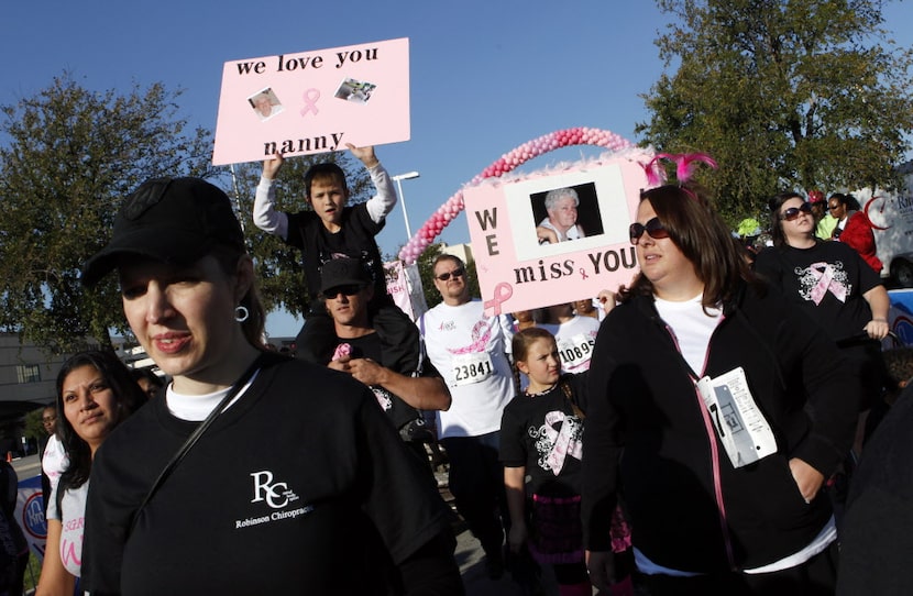 Participants crossed the finish line during the Komen Dallas Race for the Cure at NorthPark...