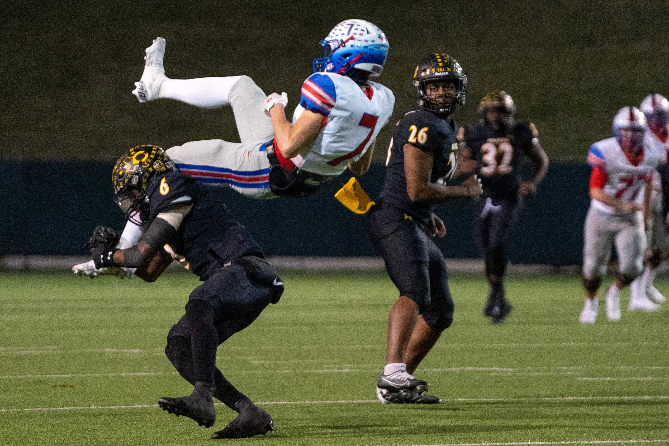 Crandall junior defensive back Kendrick Jones (6) takes out the legs of Midlothian Heritage...