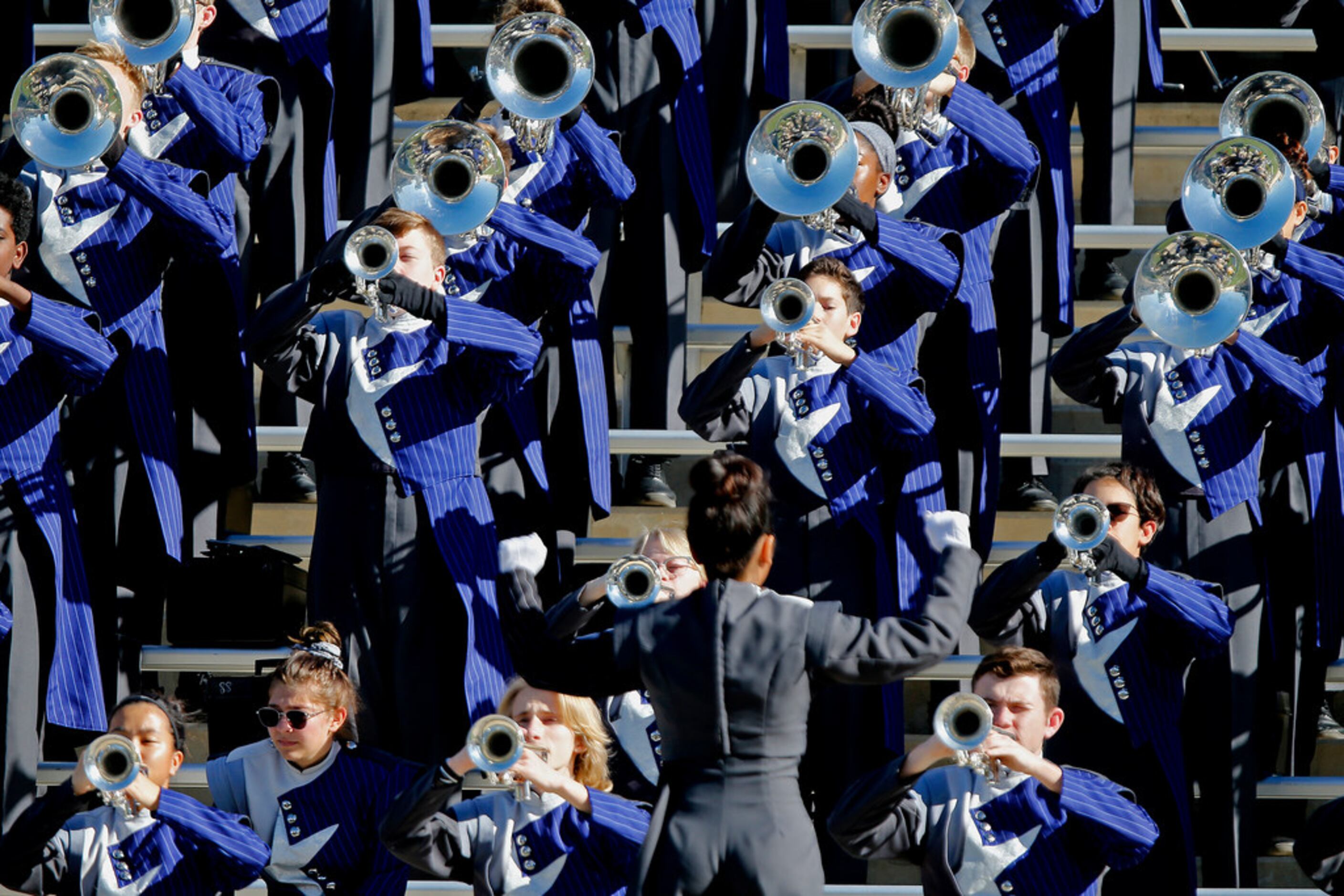 The Lone Star High School marching band performs before kickoff as Frisco Lone Star High...