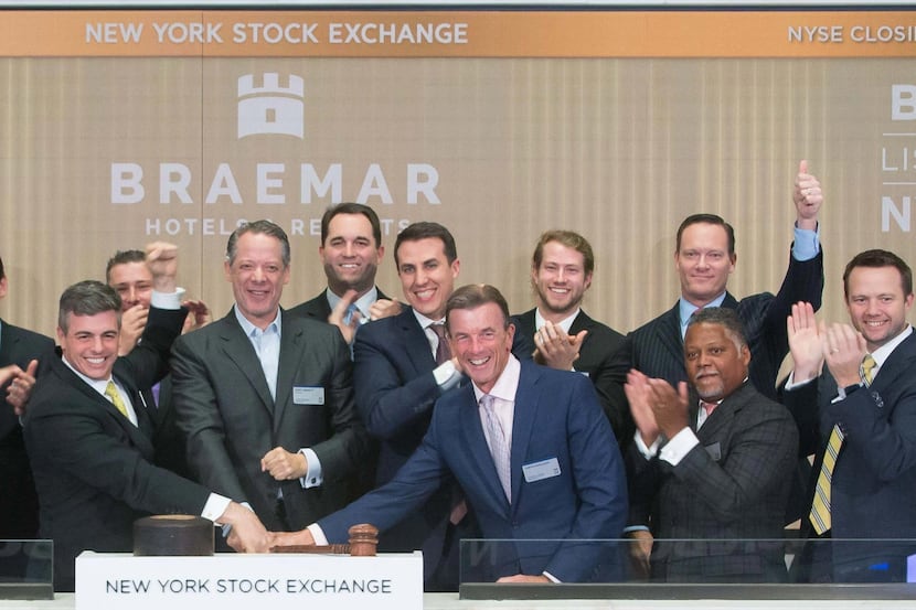 Dallas hotel executive Monty Bennett (center) rang the closing bell at the New York Stock...