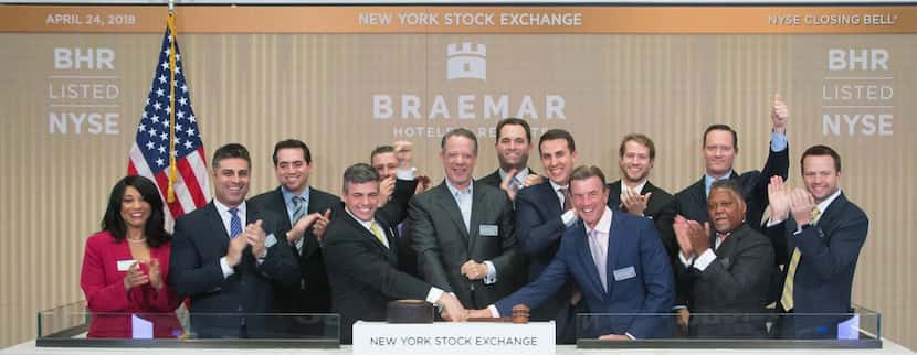 Dallas hotel executive Monty Bennett (center) rang the closing bell at the New York Stock...