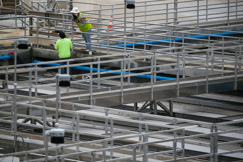 Work crews at the North Texas Municipal Water District complex. The water usage of the 13...