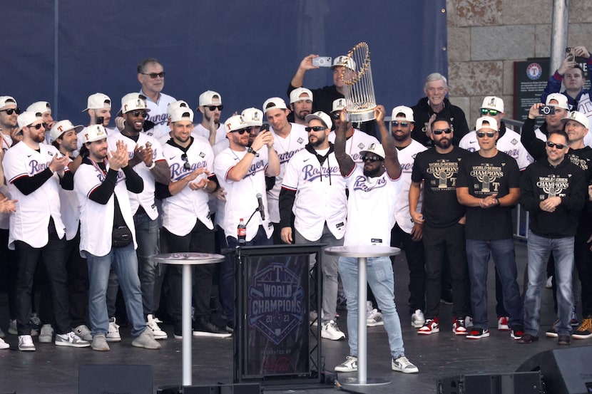 The Texas Rangers hoist the Commissioner's Trophy at the ceremony following the World Series...