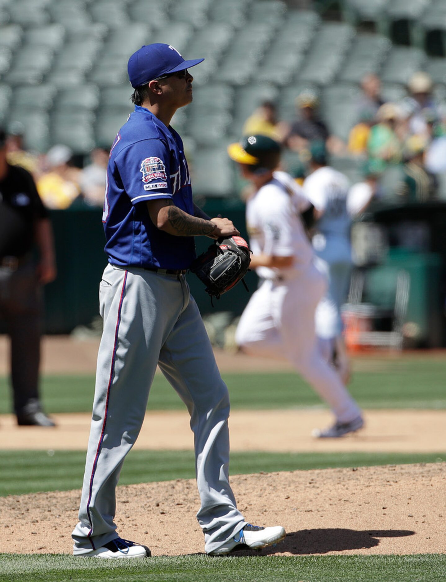 Oakland Athletics' Matt Chapman, rear, rounds the bases after hitting a solo home run off of...