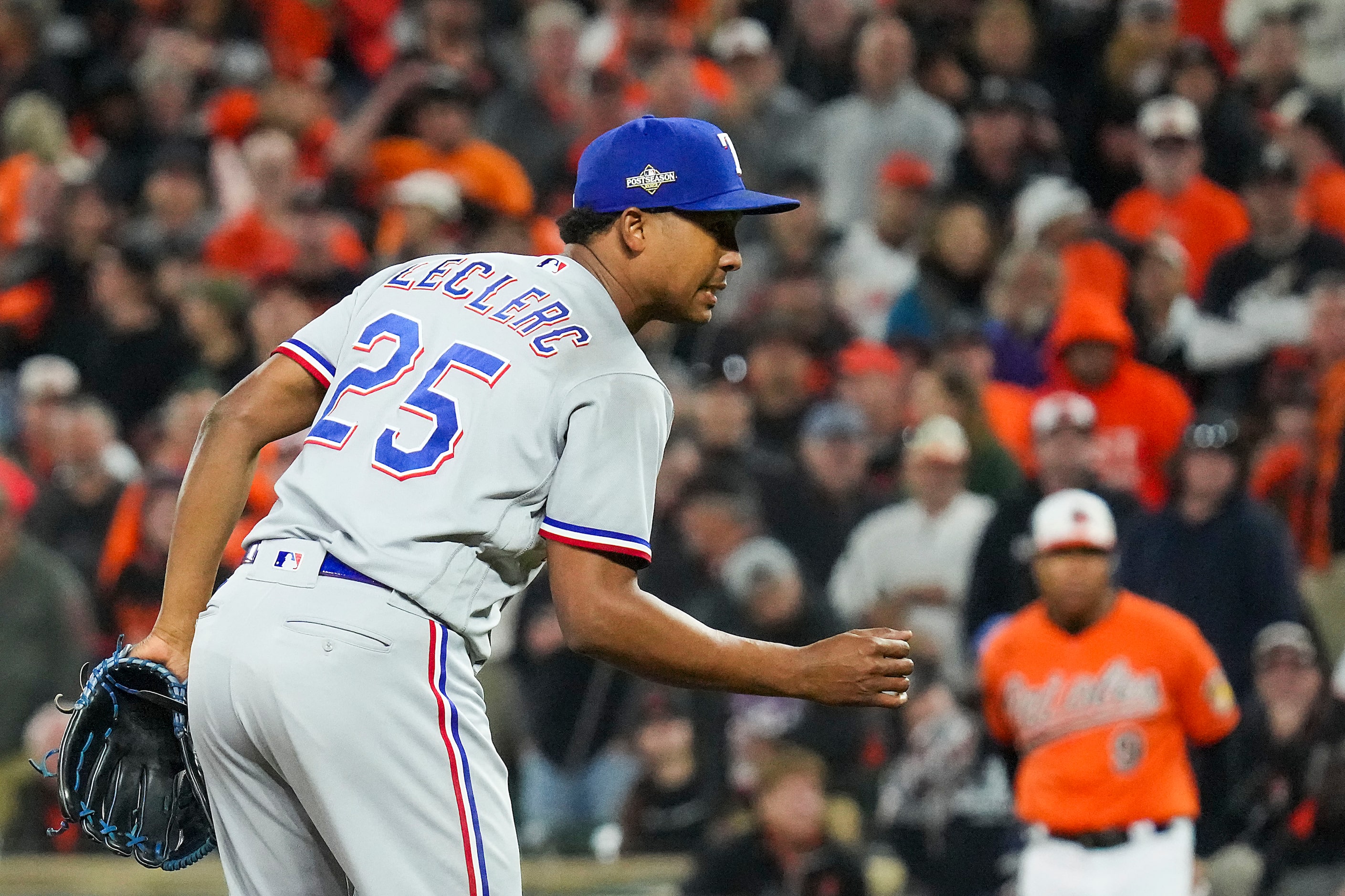 Texas Rangers relief pitcher Jose Leclerc celebrates after striking out Baltimore Orioles...