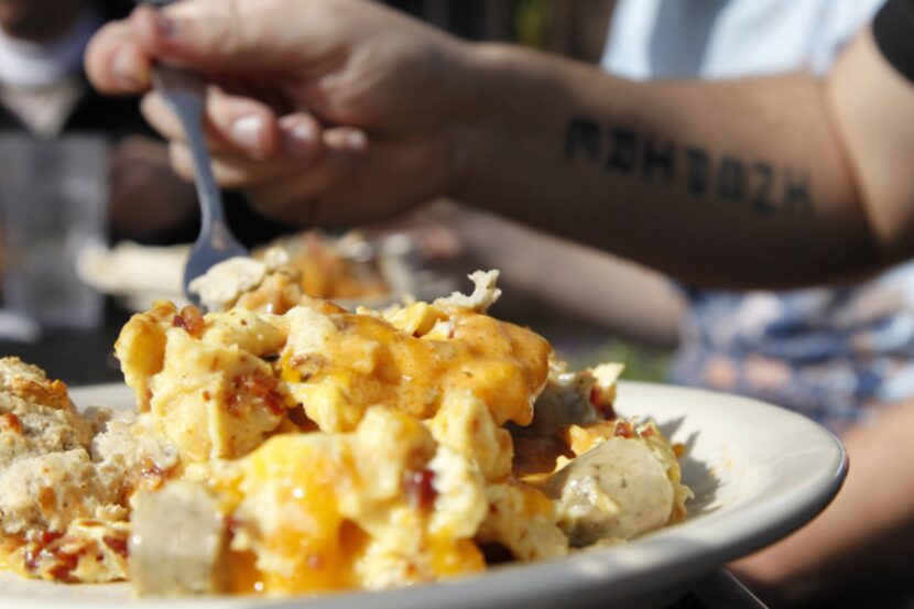 A plate of the Kure (bacon, sausage biscuits, gravy and egg with Tabasco) at Jonathon's Oak...