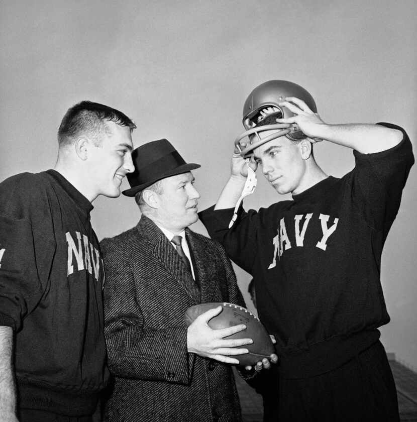 Navy coach Wayne Hardin (center) talks with his star quarterback, Roger Staubach (right), in...