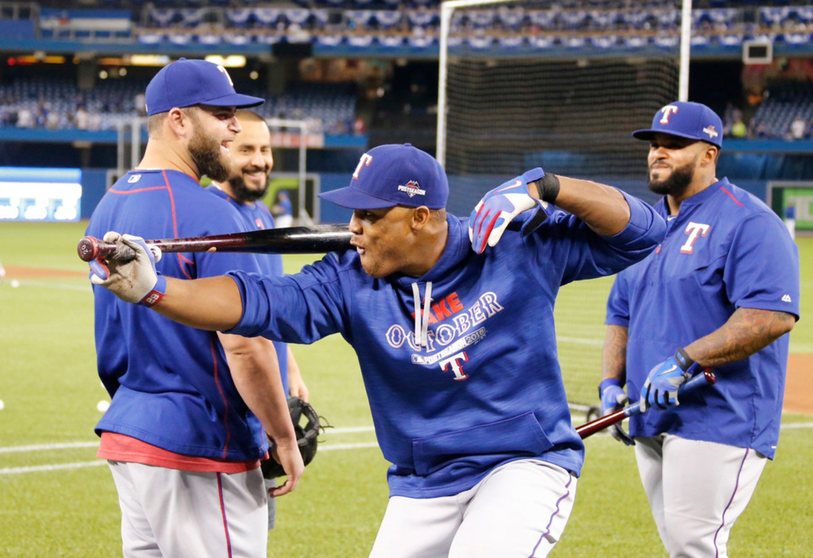 Texas Rangers Adrian Beltre (29) goes through a slow motion swing as teammates Mike Napoli...