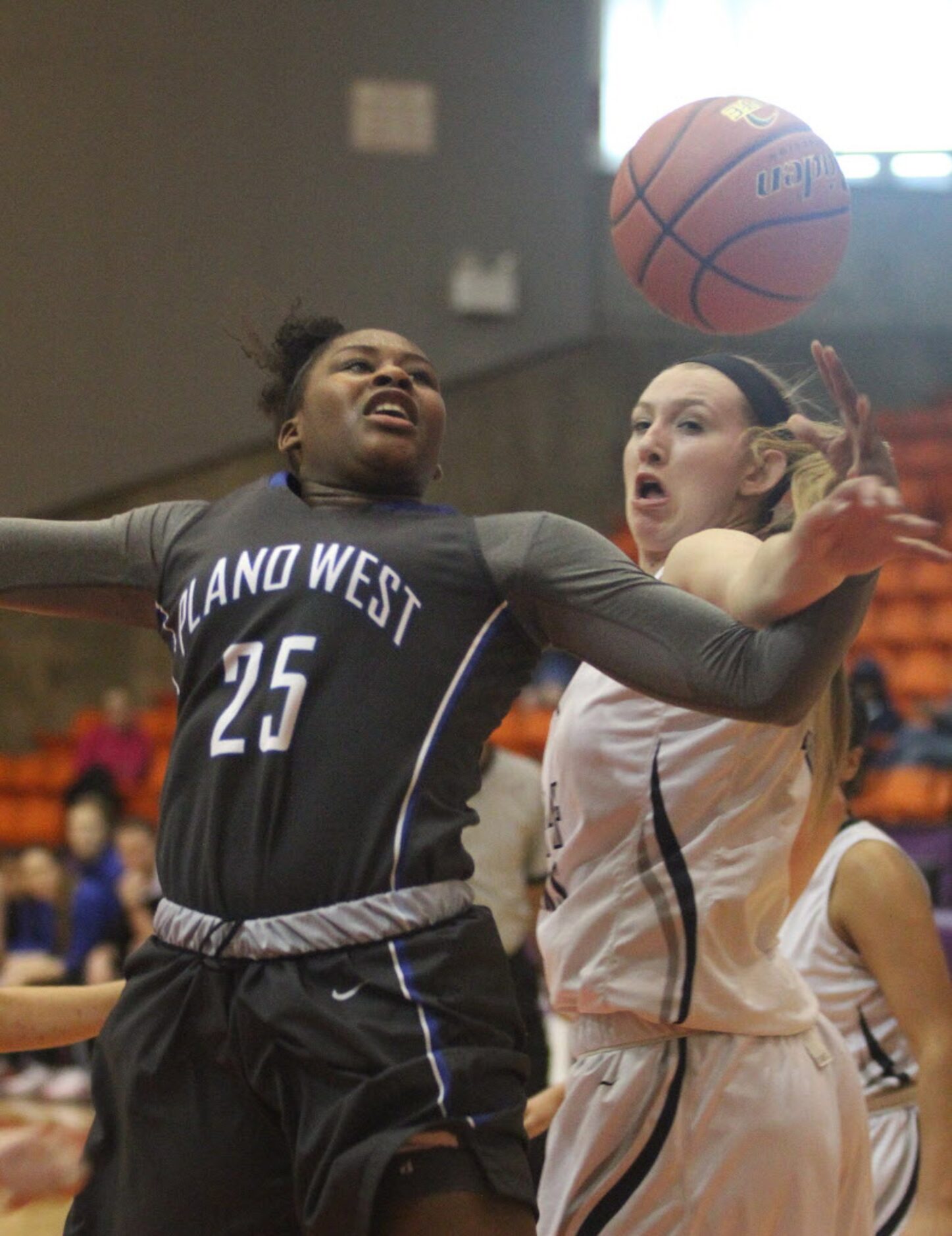 Plano West senior Sydney Skinner (25) is fouled by Flower Mound High School junior Lauren...