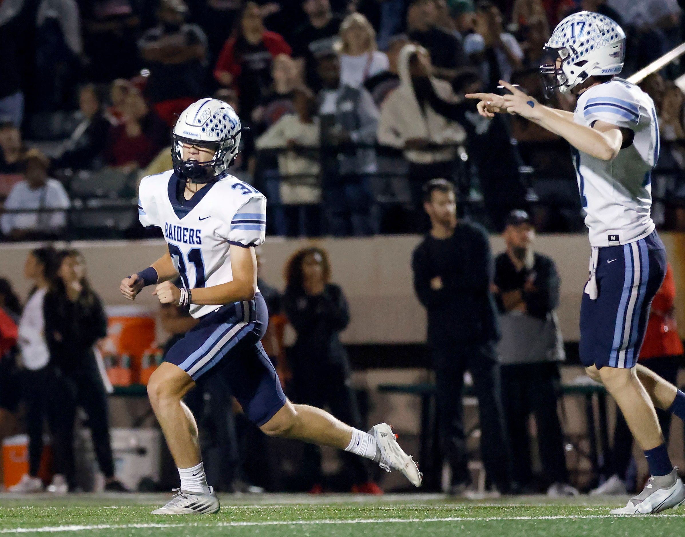 Hurst L.D. Bell kicker AJ Rosen (31) celebrates his overtime field goal against Euless...