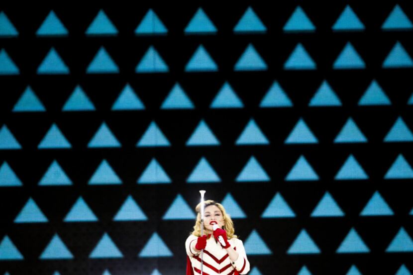 Madonna performs "Express Yourself" in front of a massive video graphic display at the...