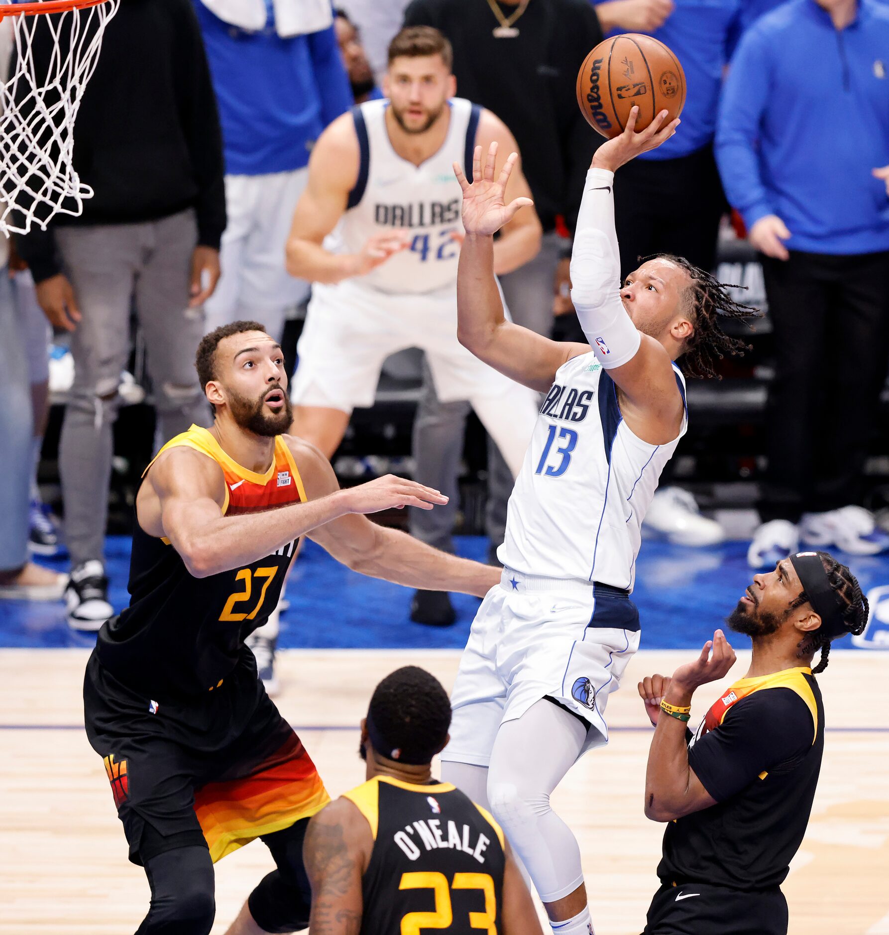 Dallas Mavericks guard Jalen Brunson (13) puts up a running shot over the Utah Jazz defense...