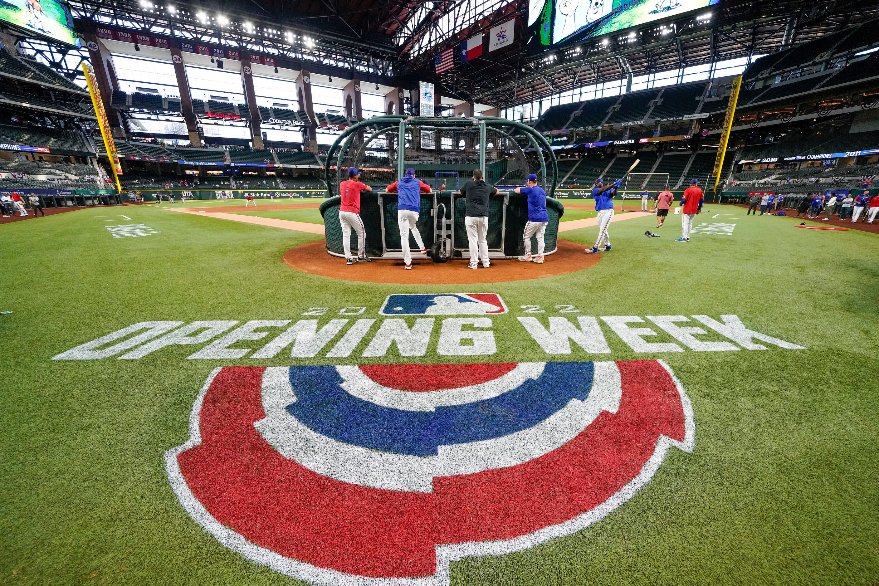 Texas Rangers players take batting practice before the team’s home opener against the...