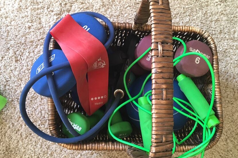 In my den is a basket filled with inexpensive workout stuff. Bet there's room in your den...