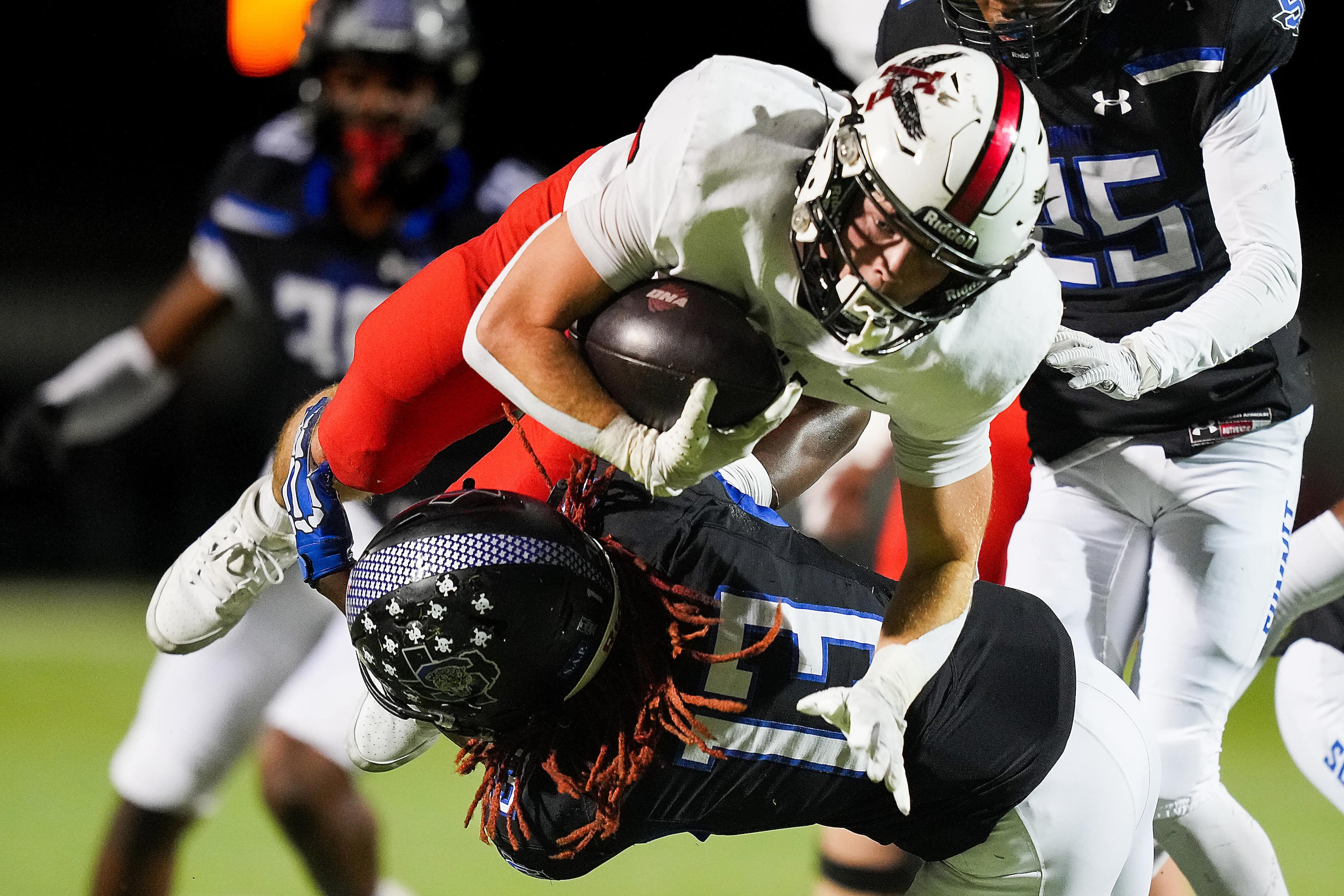 Argyle running back Watson Bell (6) is brought down by Mansfield Summit defensive back...