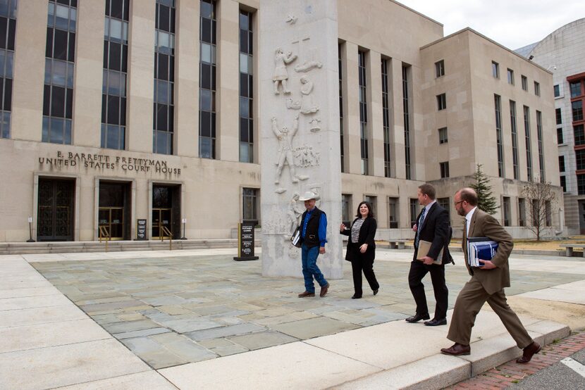 Cheyenne River Sioux Tribe attorneys leave the Federal Courthouse in Washington, Tuesday,...