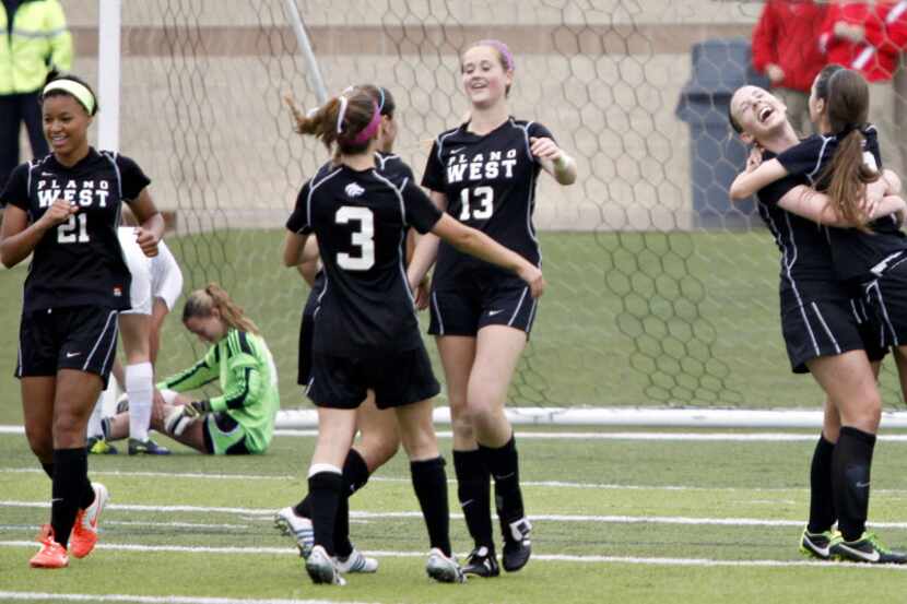 Plano West players celebrate after a goal by Lakyn Pope (21)  against the San Antonio Reagan...