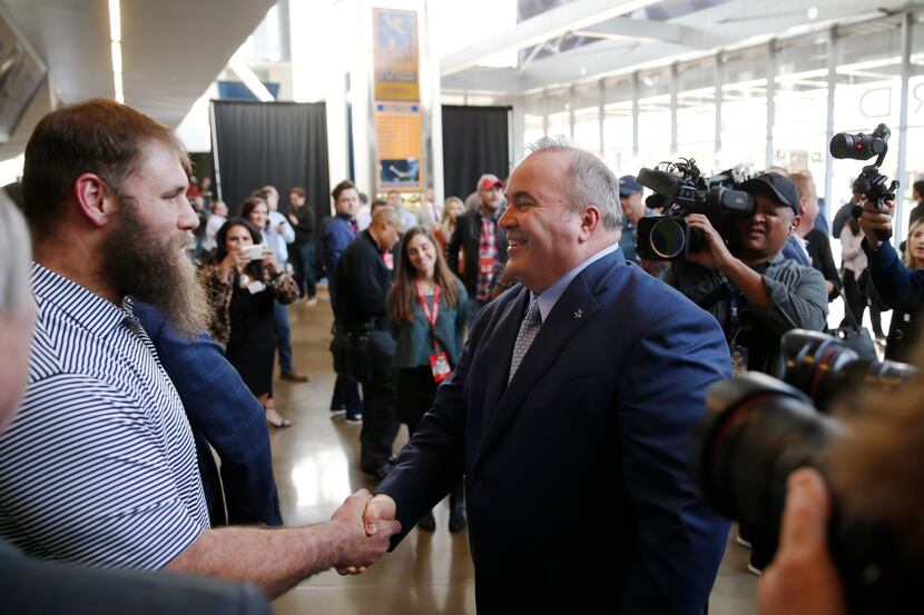 FILE - Cowboys center Travis Frederick (72) meets new head coach Mike McCarthy after his...