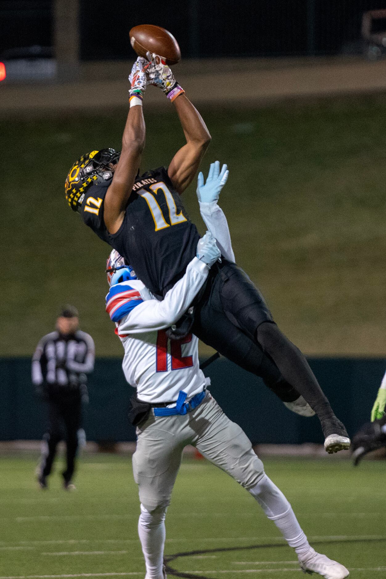 Crandall junior wide receiver Josh Smith (12) cannot quite make the catch as he is wrapped...