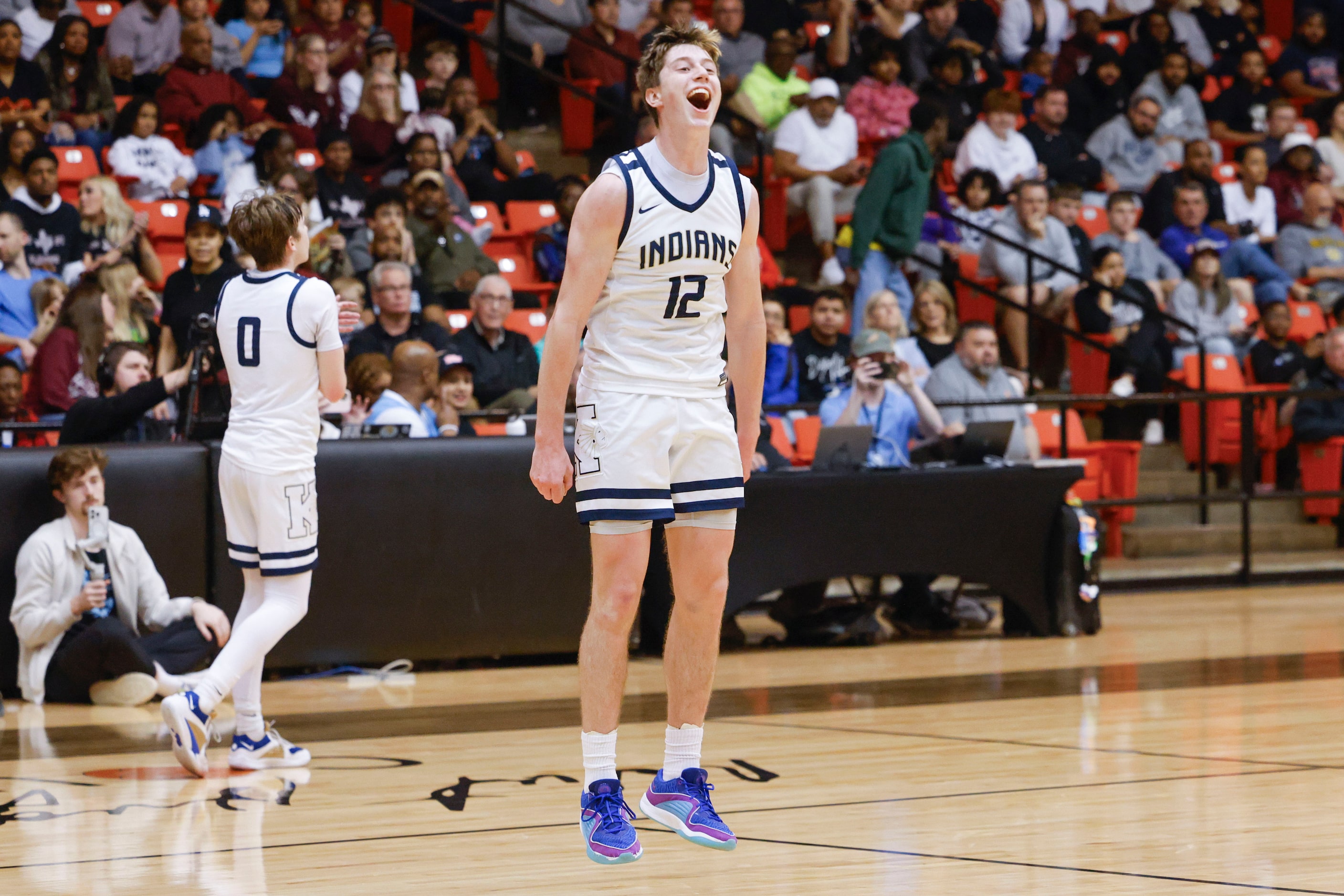 Keller High players including Rhett Schank (12) cheers following their win in the Class 6A...