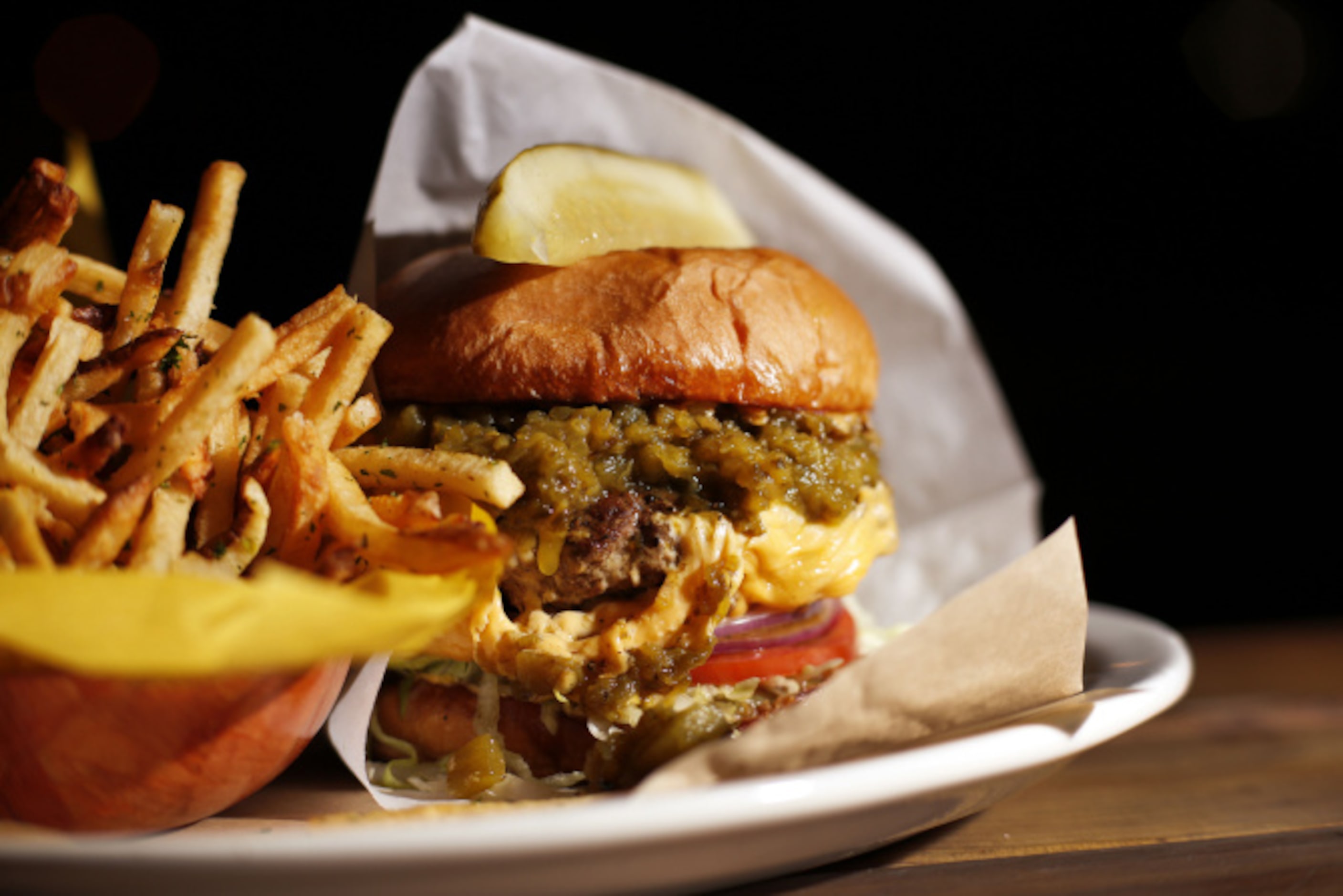 Half-Pound chuck-and-brisket burger with roasted green chile and fries at the Tried and True