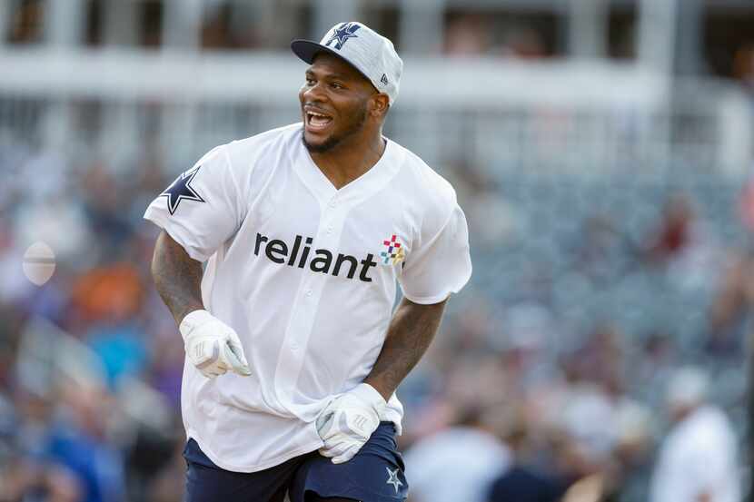 Dallas Cowboys linebacker Micah Parsons celebrates as he rounds the bases after hitting a...