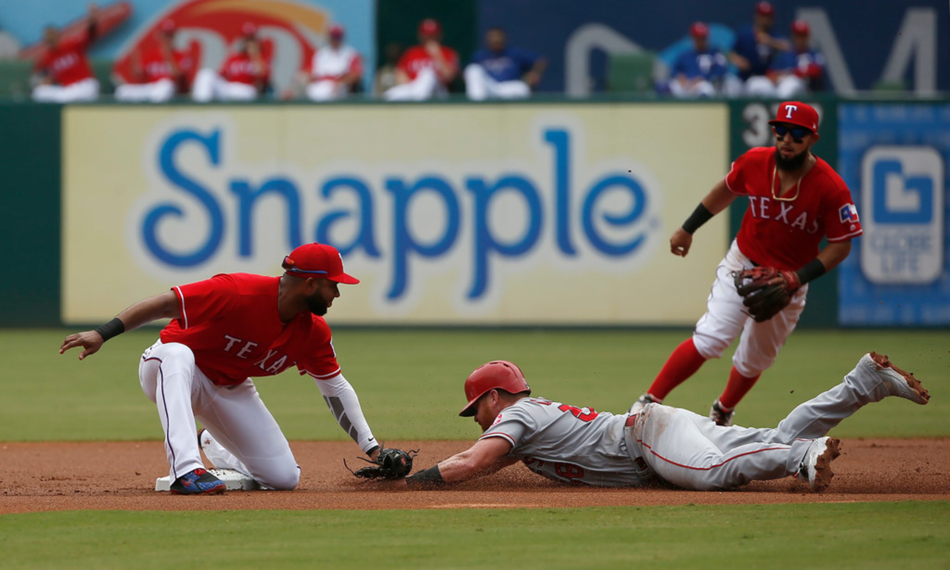 ARLINGTON, TX - AUGUST 19: Kole Calhoun #56 of the Los Angeles Angels of Anaheim is tagged...