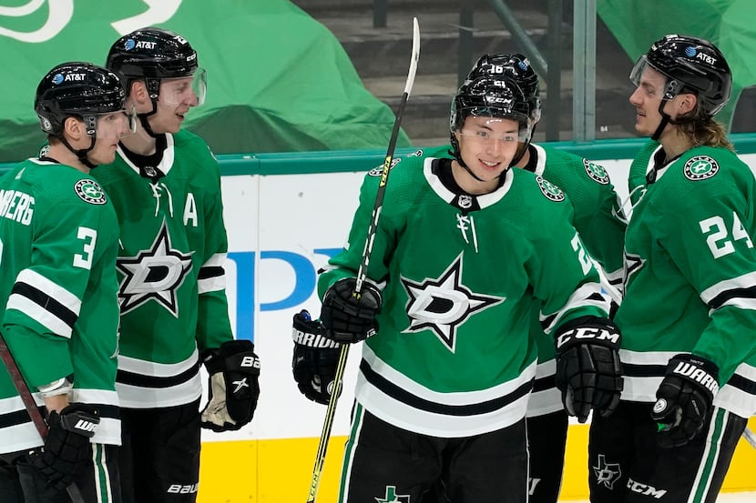 Dallas Stars' John Klingberg (3), Esa Lindell, left rear, Jason Robertson (21), Joe...