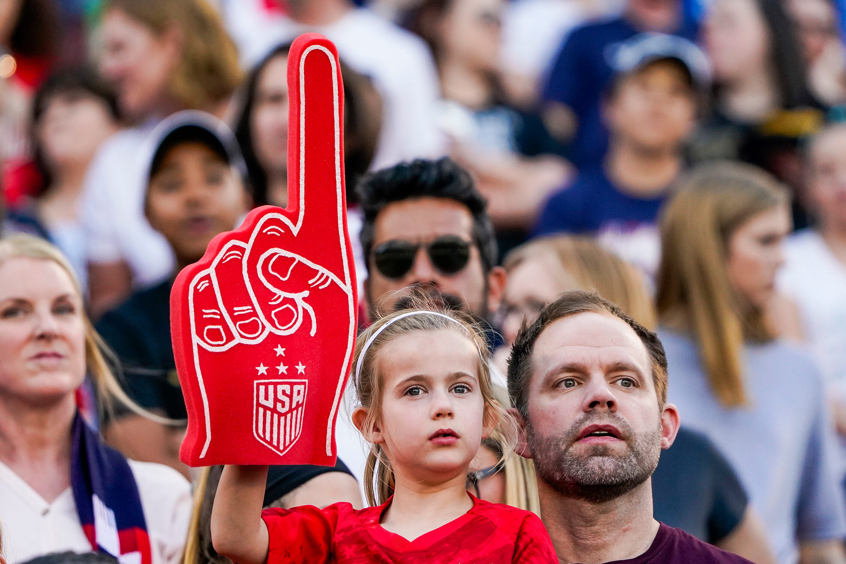 Young fans cheer the USA before a SheBelieves Cup soccer game against Japan on Wednesday,...