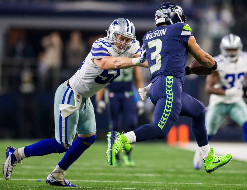 Dallas Cowboys middle linebacker Sean Lee (50) pushes Seattle Seahawks quarterback Russell...