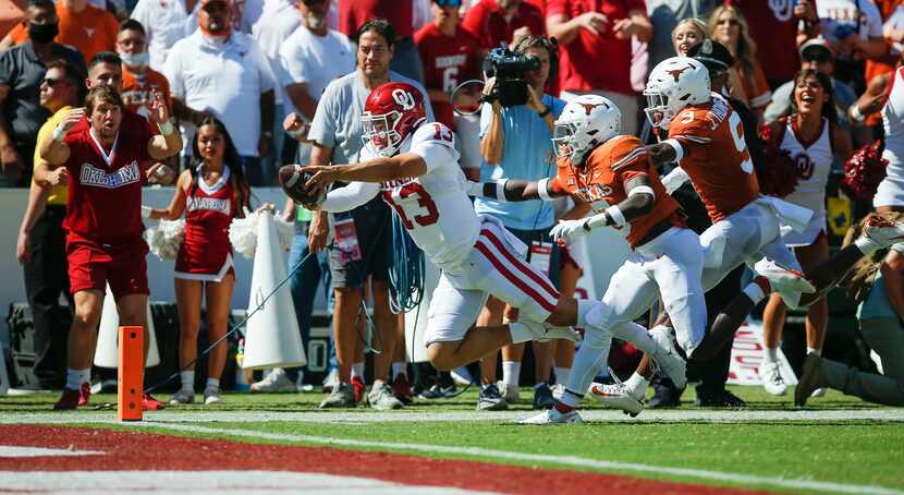 Oklahoma quarterback Caleb Williams (13) dives to score a touchdown during the first half of...