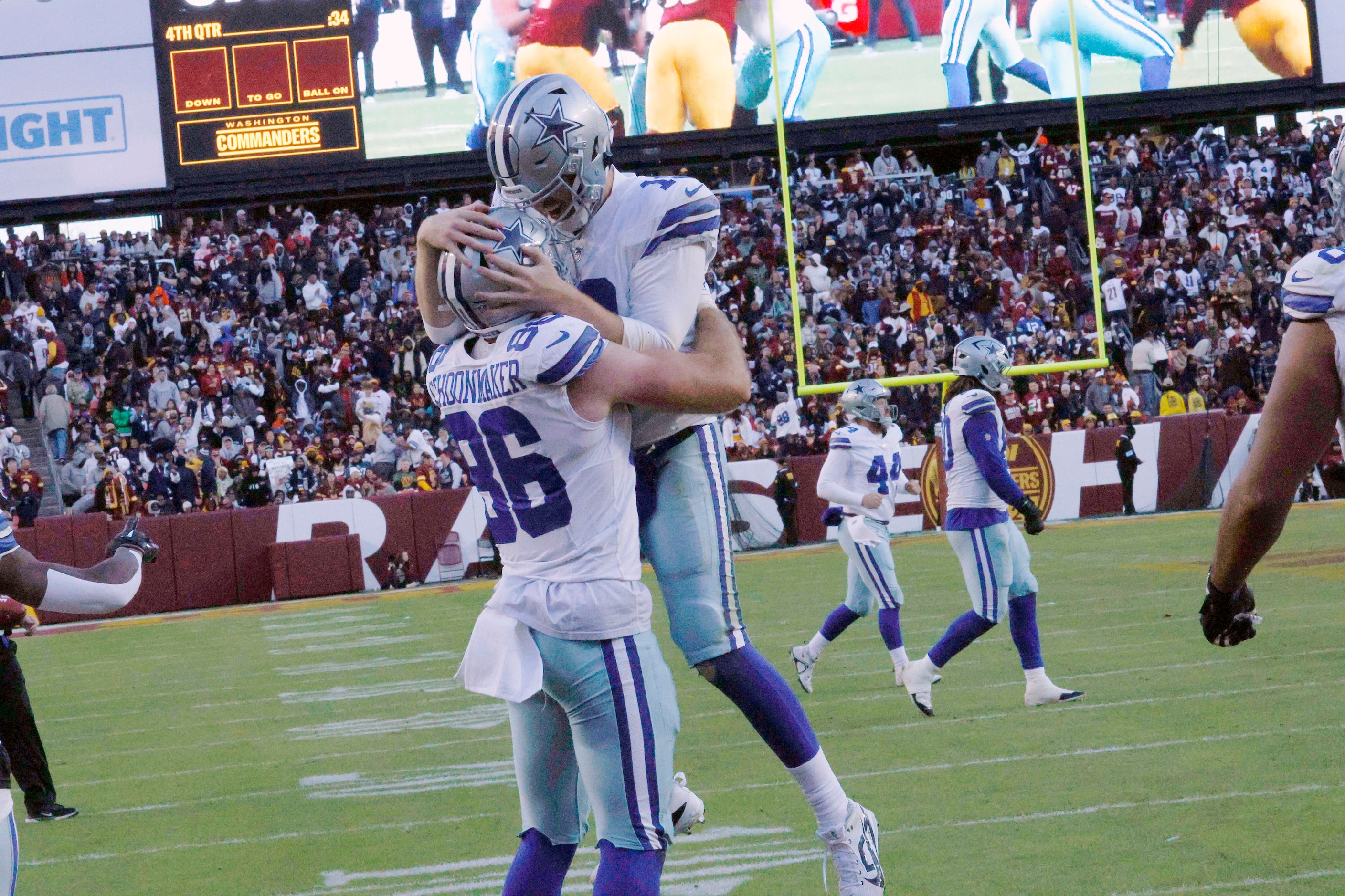 Dallas Cowboys quarterback Cooper Rush (10), right, celebrates his touchdown pass to Dallas...