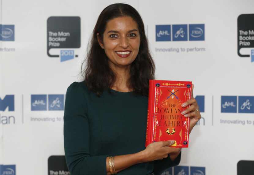Author Jhumpa Lahiri poses with her book 'The Lowland' in London. Lahiri, Thomas Pynchon,...