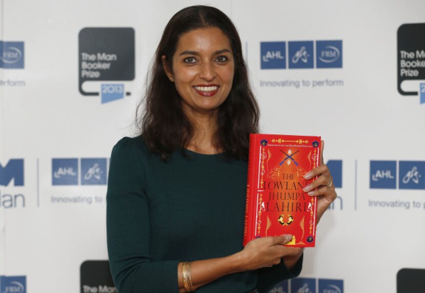 Author Jhumpa Lahiri poses with her book 'The Lowland' in London. Lahiri, Thomas Pynchon,...