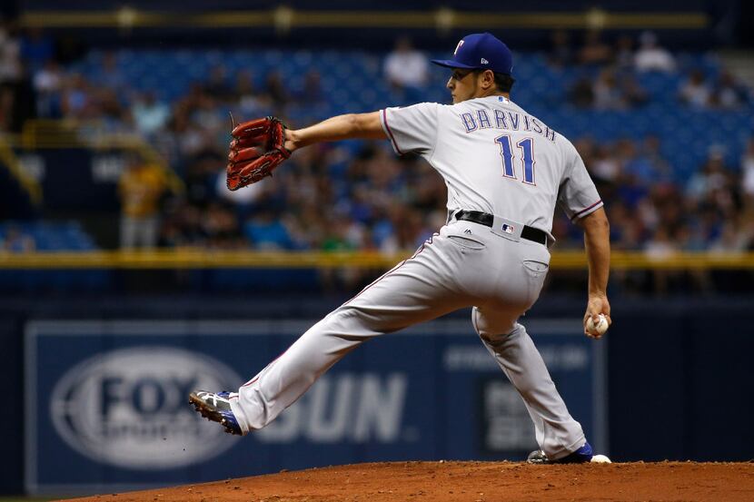 ST. PETERSBURG, FL - JULY 21: Yu Darvish #11 of the Texas Rangers pitches during the first...