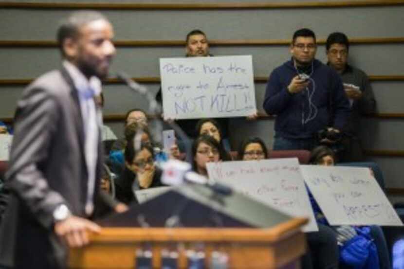  Protesters hold signs in support of Ruben Garcia Villalpando, who was fatally shot by a...