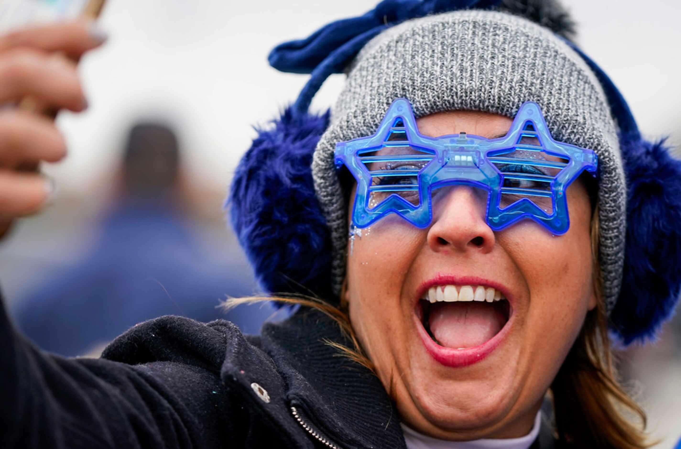 Elsa Madrid of Grapevineas takes a selfies as fans tailgate before an NFL football game at...
