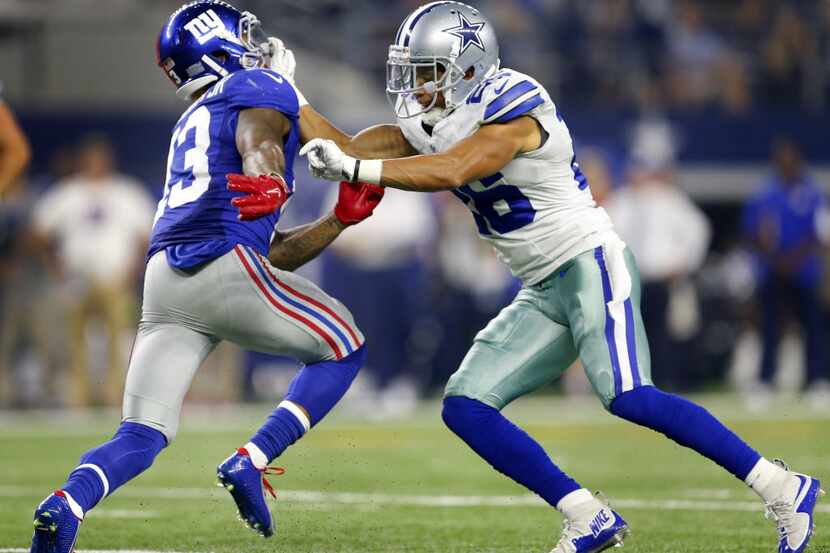 Dallas Cowboys defensive back Tyler Patmon (26) gives New York Giants wide receiver Odell...
