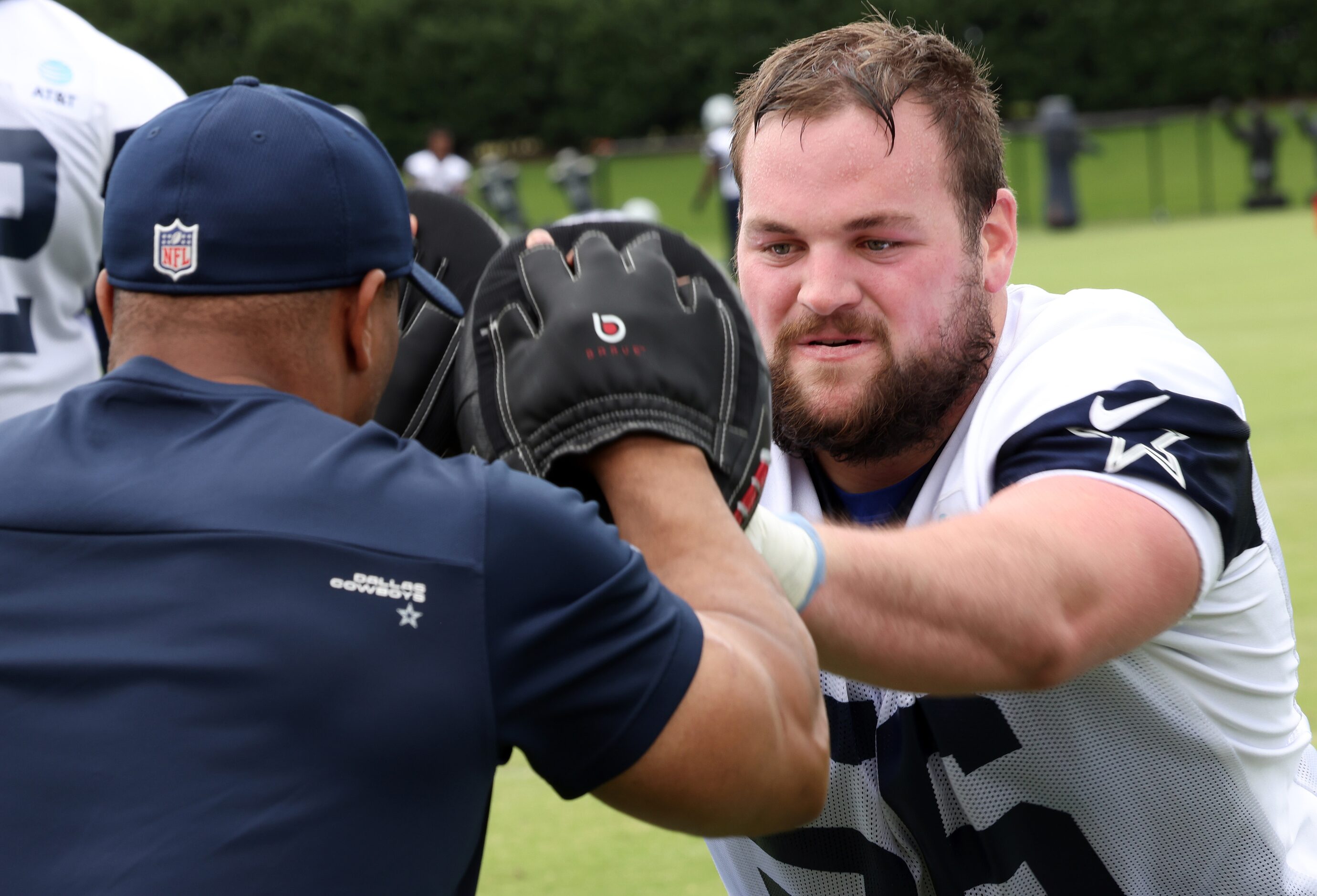 Dallas Cowboys offensive lineman Cooper Beebe (56) works through a hand-eye coordination...