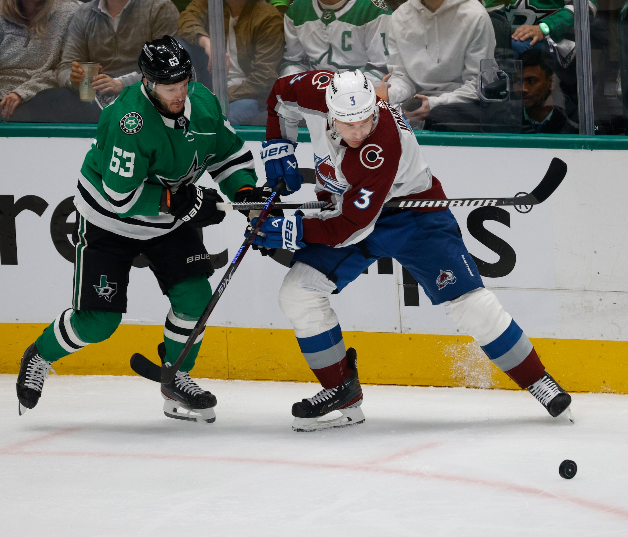 Dallas Stars right wing Evgenii Dadonov (63) and Colorado Avalanche defenseman Jack Johnson...