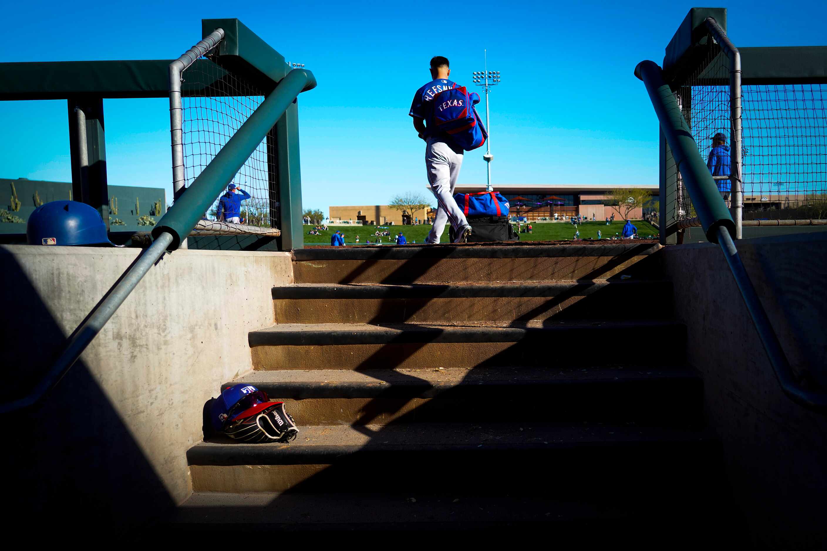 Texas Rangers outfielder Rob Refsnyder heads to the team bus after a 4-3 loss to the...