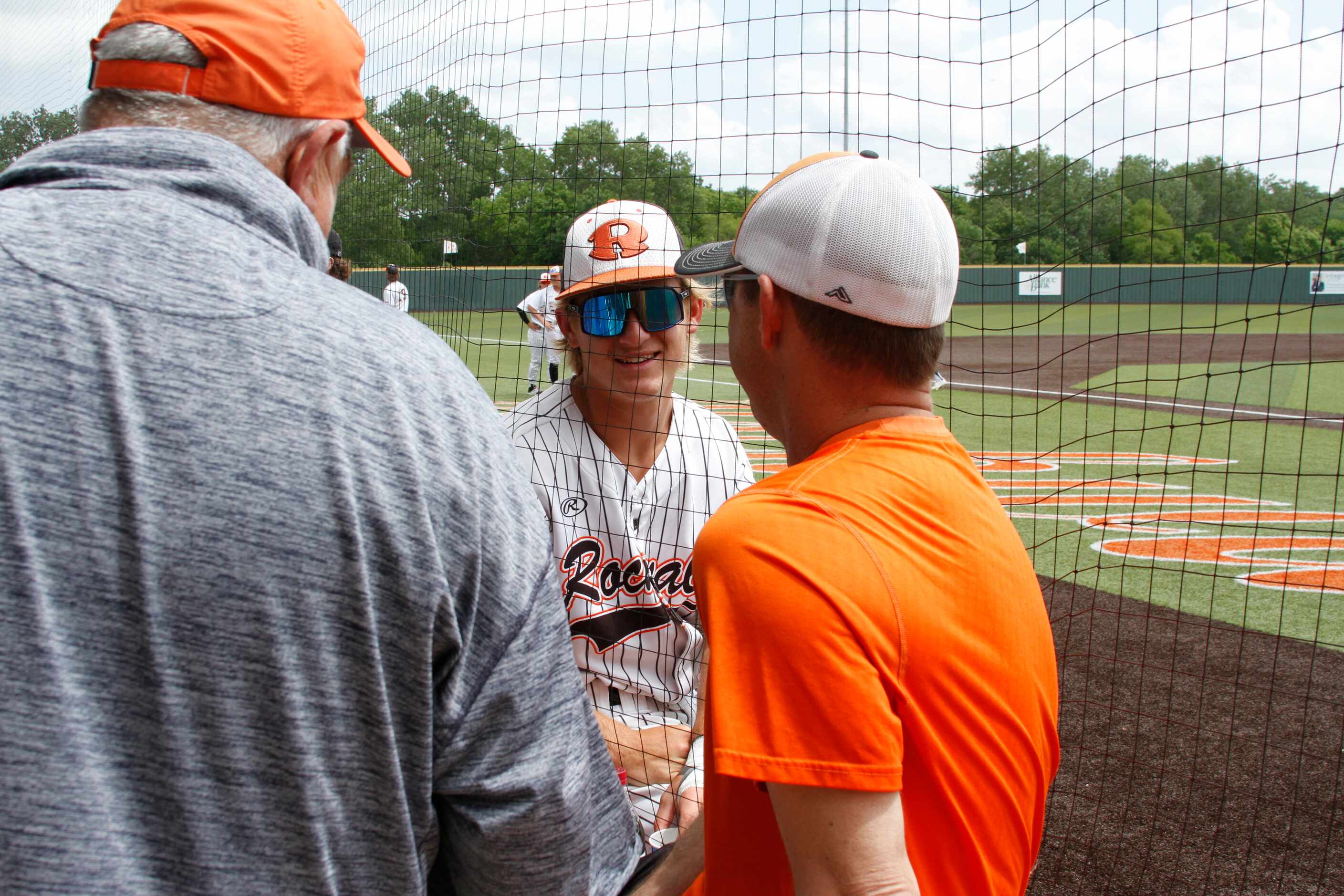 Rockwall shortstop Brayden Randle visits with fans before the start of their game against...