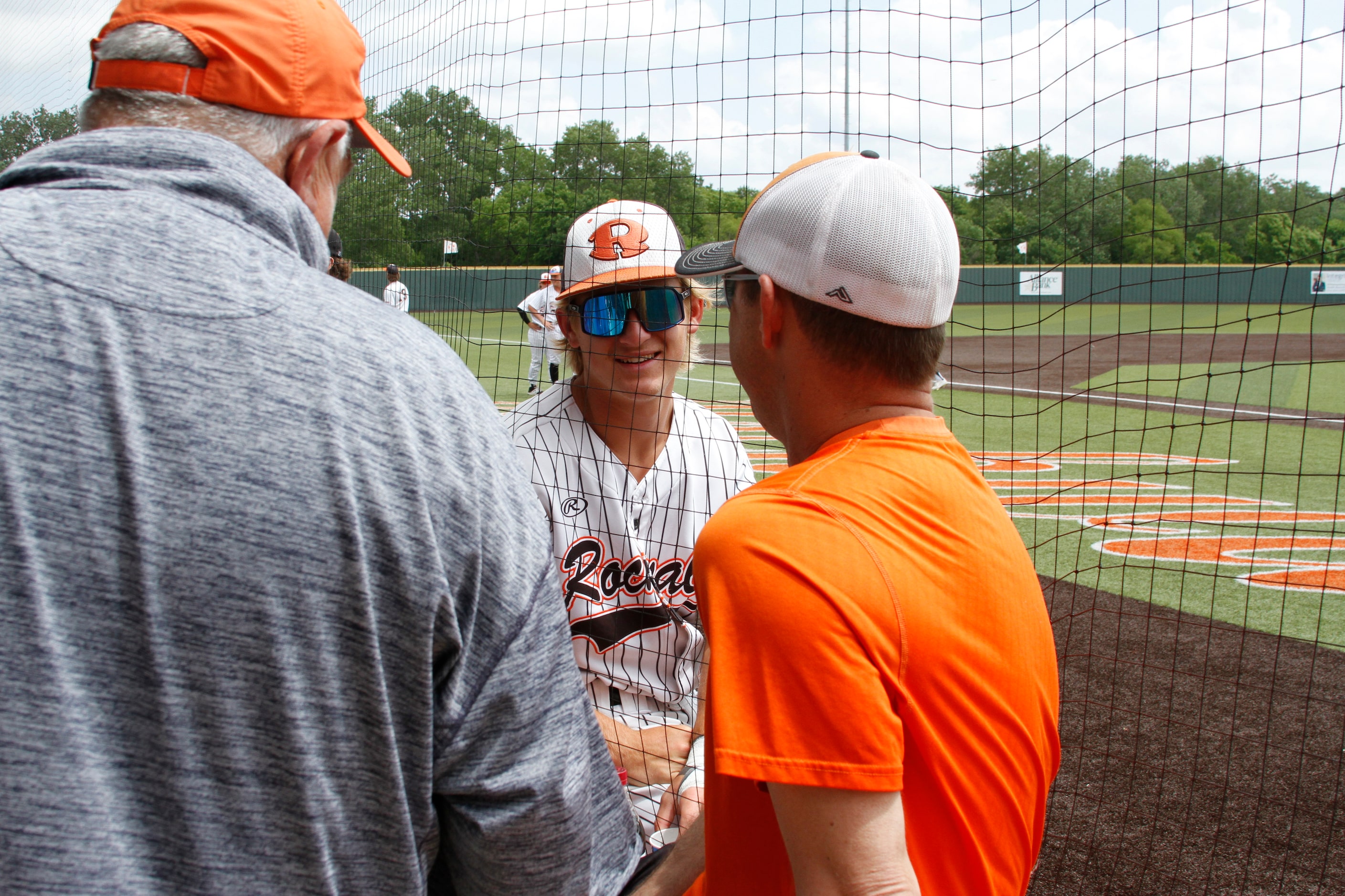 Rockwall shortstop Brayden Randle visits with fans before the start of their game against...