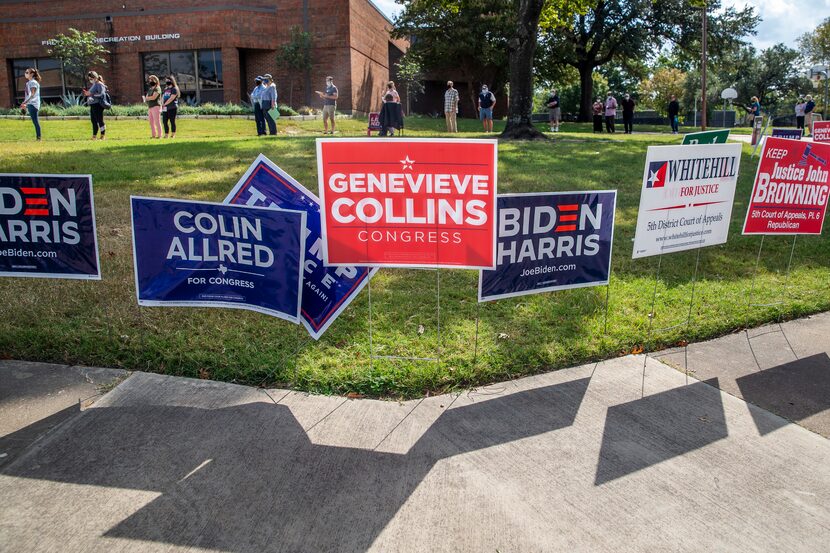 Voters line up to cast their ballot during the early voting period for the general U.S....