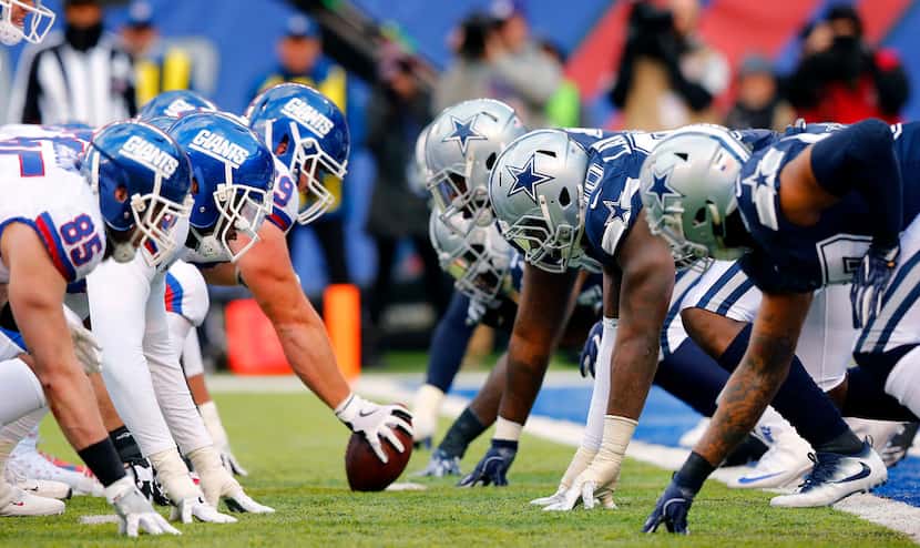 The New York Giants offensive line squares off against the Dallas Cowboys defensive line...